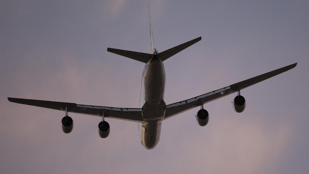 DC-8 in the sky at sunset or sunrise